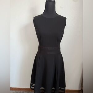 This item is a Calvin Klein Illusion-Trim Fit & Flare. Size 8
